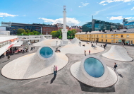 Oberlichter lassen JKMM Architects an einem zentralen Platz in Helsinki wie Augpfel aus dem Boden ragen.